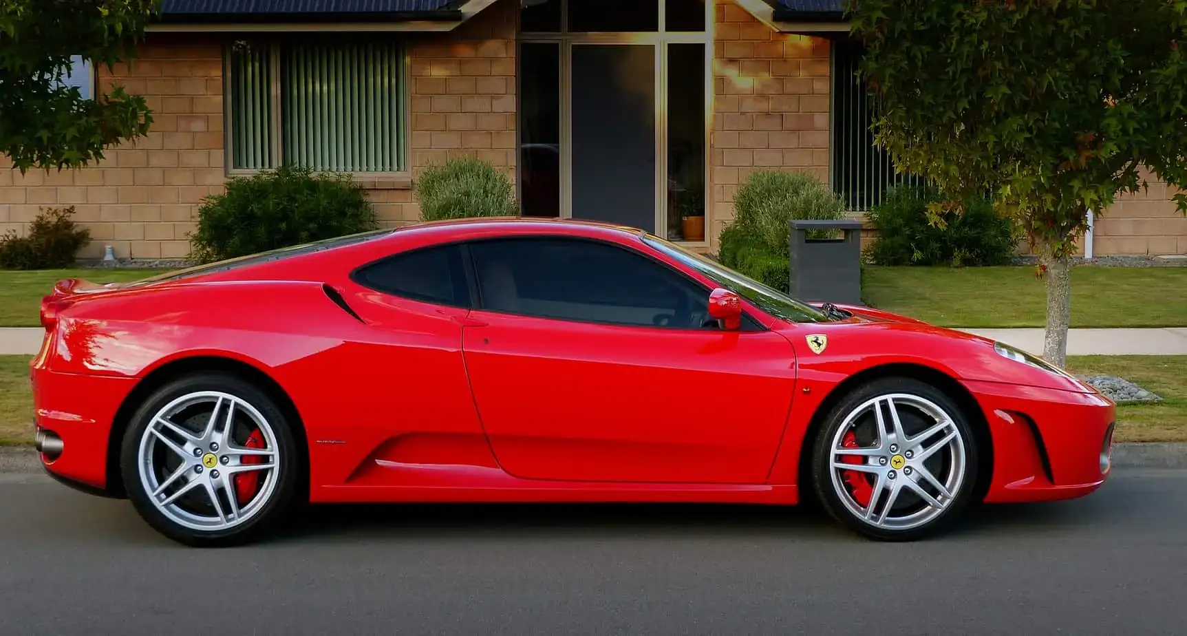 Charlotte exotic car on flatbed soft-strap transport
