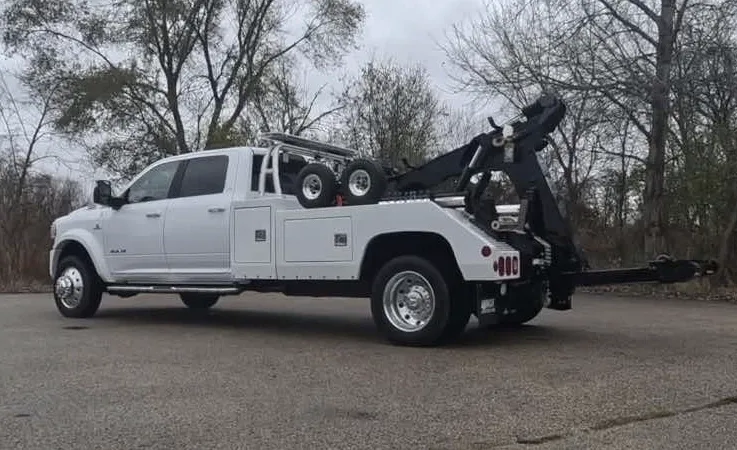 Charlotte wrecker equipment securing damaged vehicle